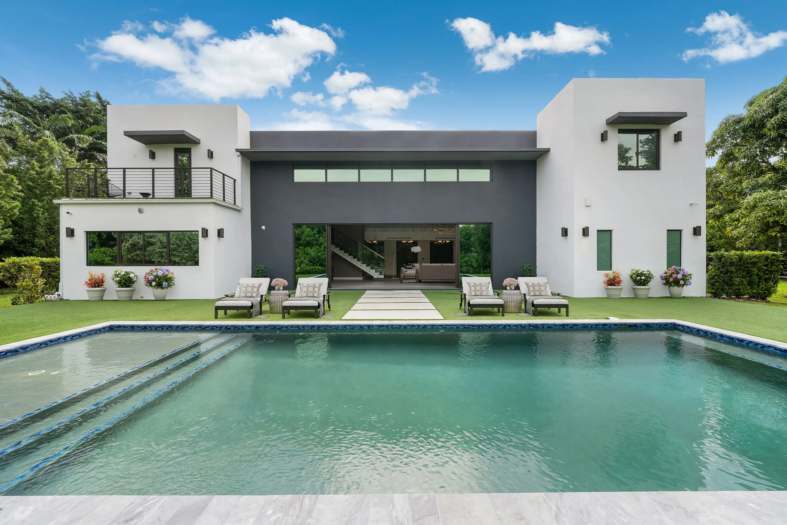 Modern facade with pool and terrace in luxury Pinecrest, Miami residence